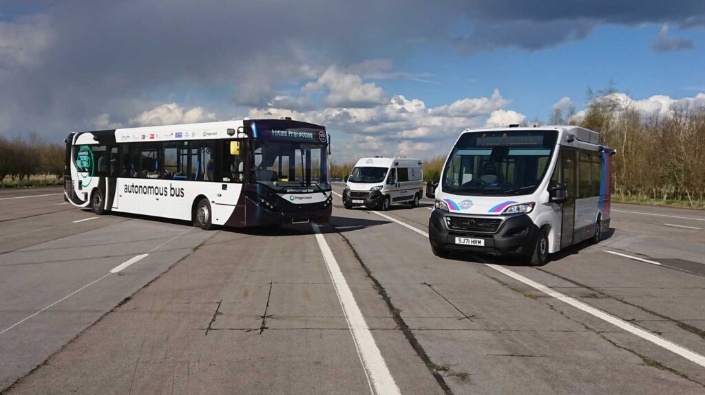 Three different buses parked on an old runway.